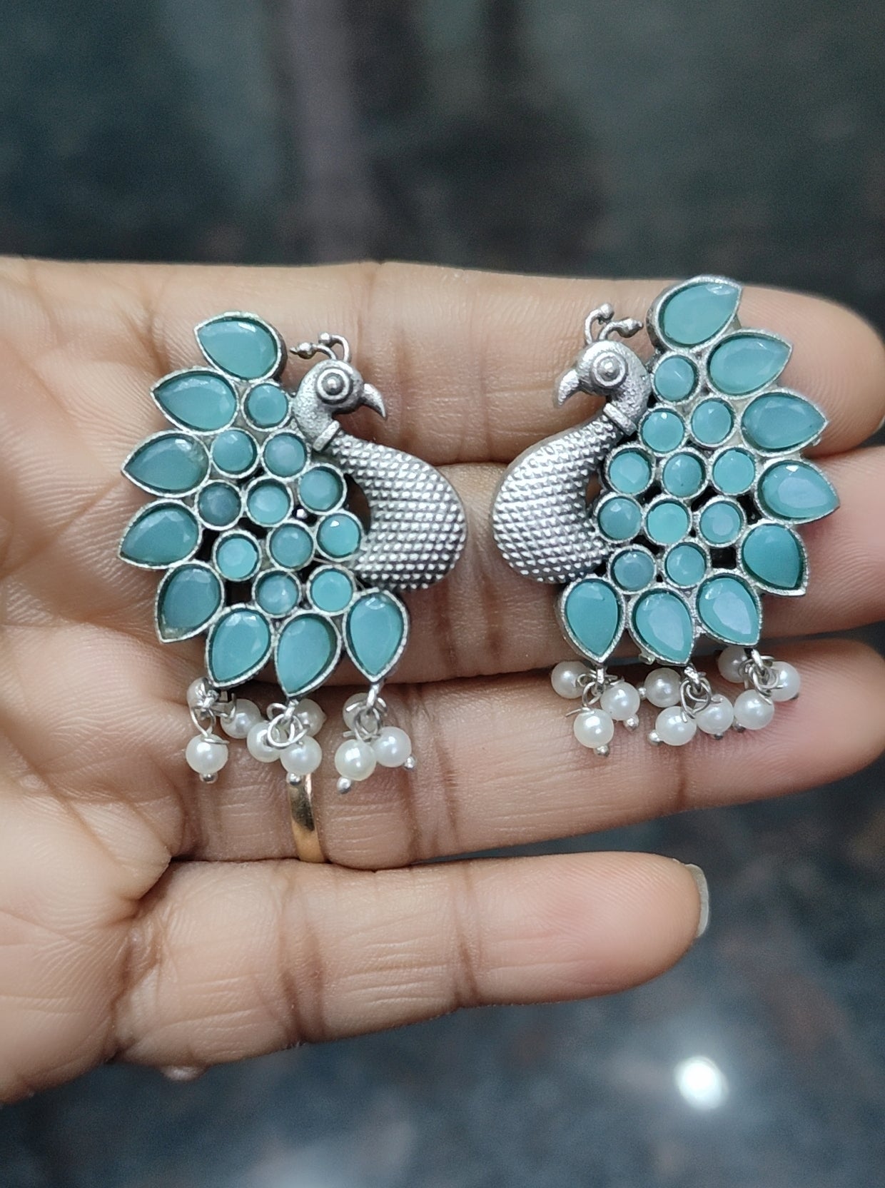 Oxidised silver peacock theme monalisa stone earrings - Nishkarsh the royal radiance