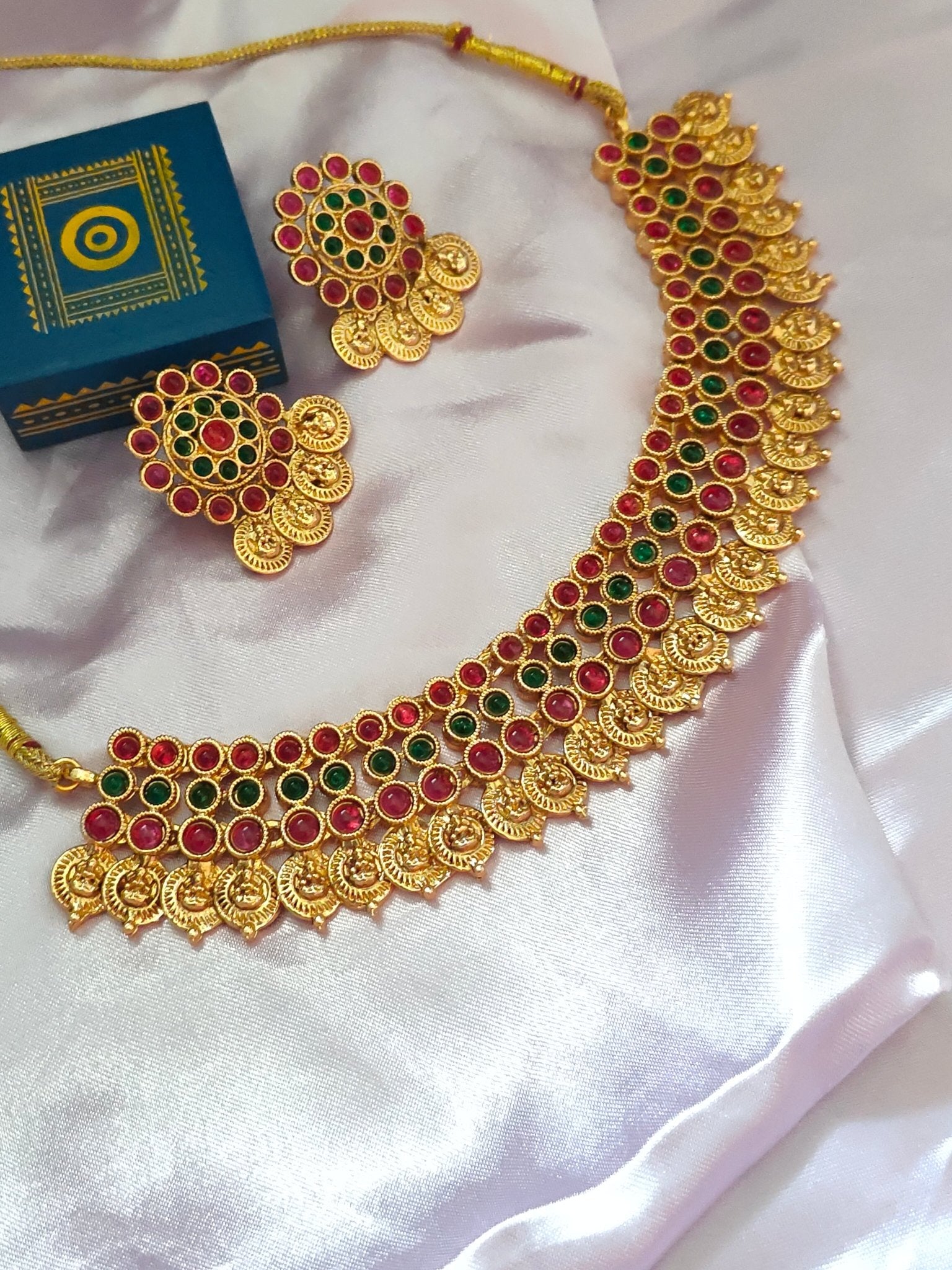 Handmade kemp ruby emerald stone lakshmi kasumalai nagas necklace set with studs - Nishkarsh the royal radiance