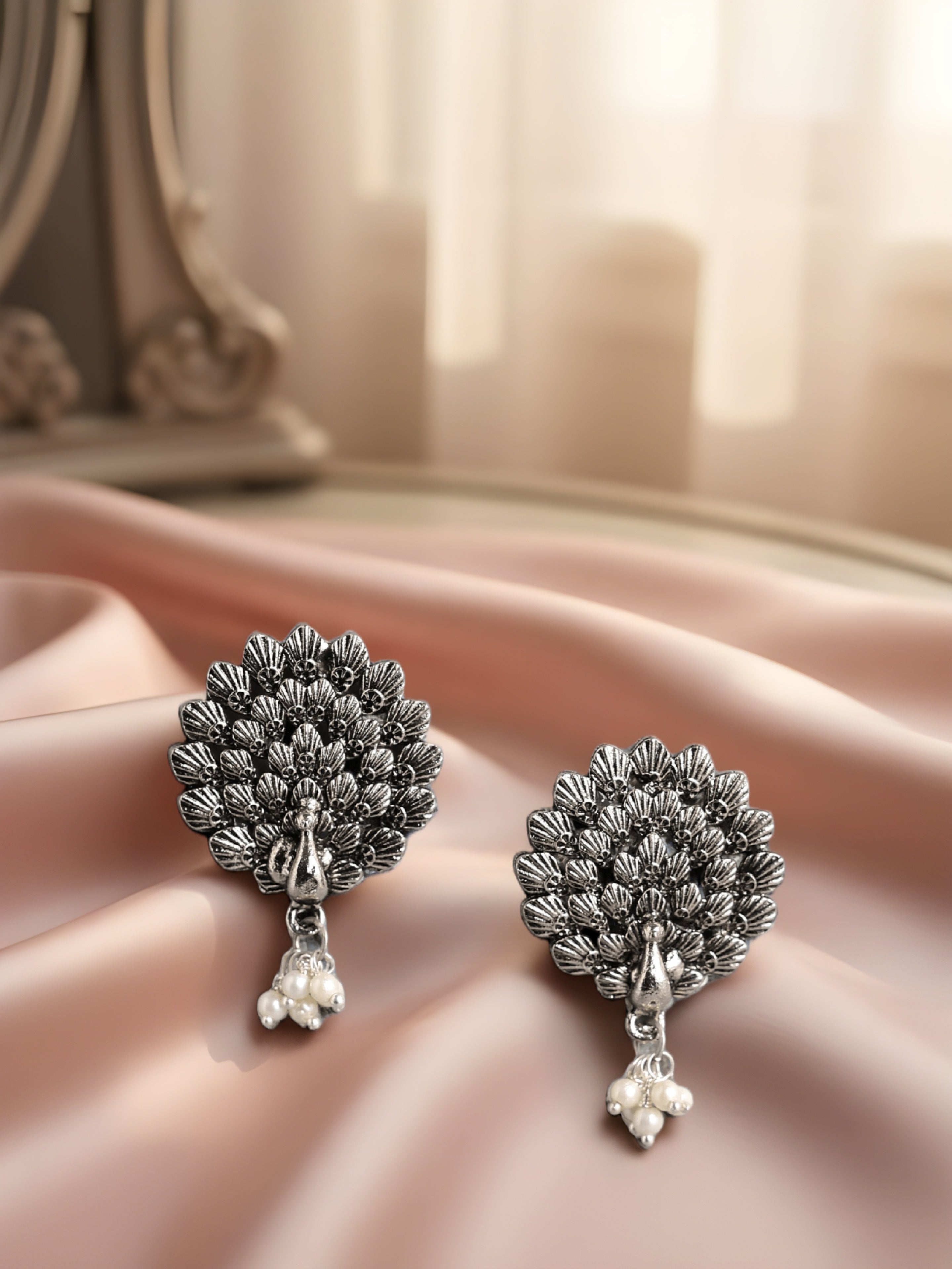 Oxidised silver peacock theme earrings